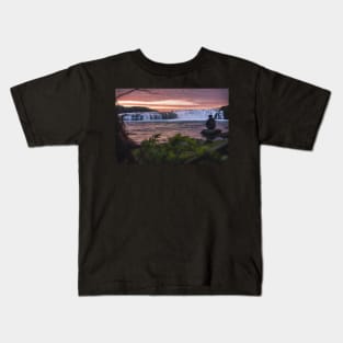 Man Watching Midnight Sunset by the Waterfall during Summer in Iceland Kids T-Shirt